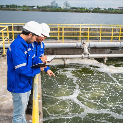 Two engineers watching over a digitally optimized wastewater treatment plant